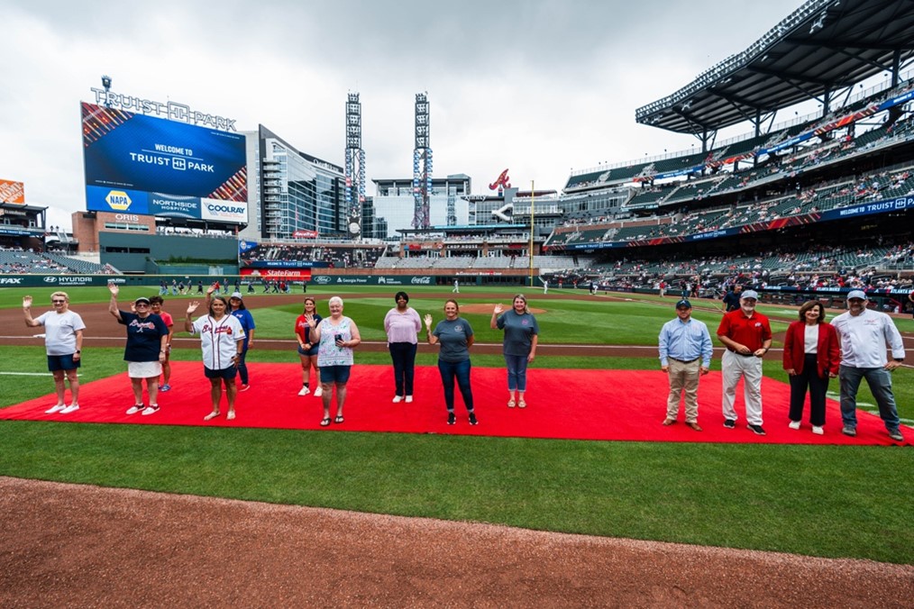 (Georgia School Nutrition Professionals Honored on the Field at Truist Park joined by Georgia Agriculture Commissioner Tyler J Harper, State Schools Superintendent Richard Woods, Dr. Linette Dodson, and Chef John Huff. Photo Courtesy of the Atlanta Braves) (Georgia School Nutrition Professionals Honored on the Field at Truist Park joined by Georgia Agriculture Commissioner Tyler J Harper, State Schools Superintendent Richard Woods, Dr. Linette Dodson, and Chef John Huff. Photo Courtesy of the Atlanta Braves)