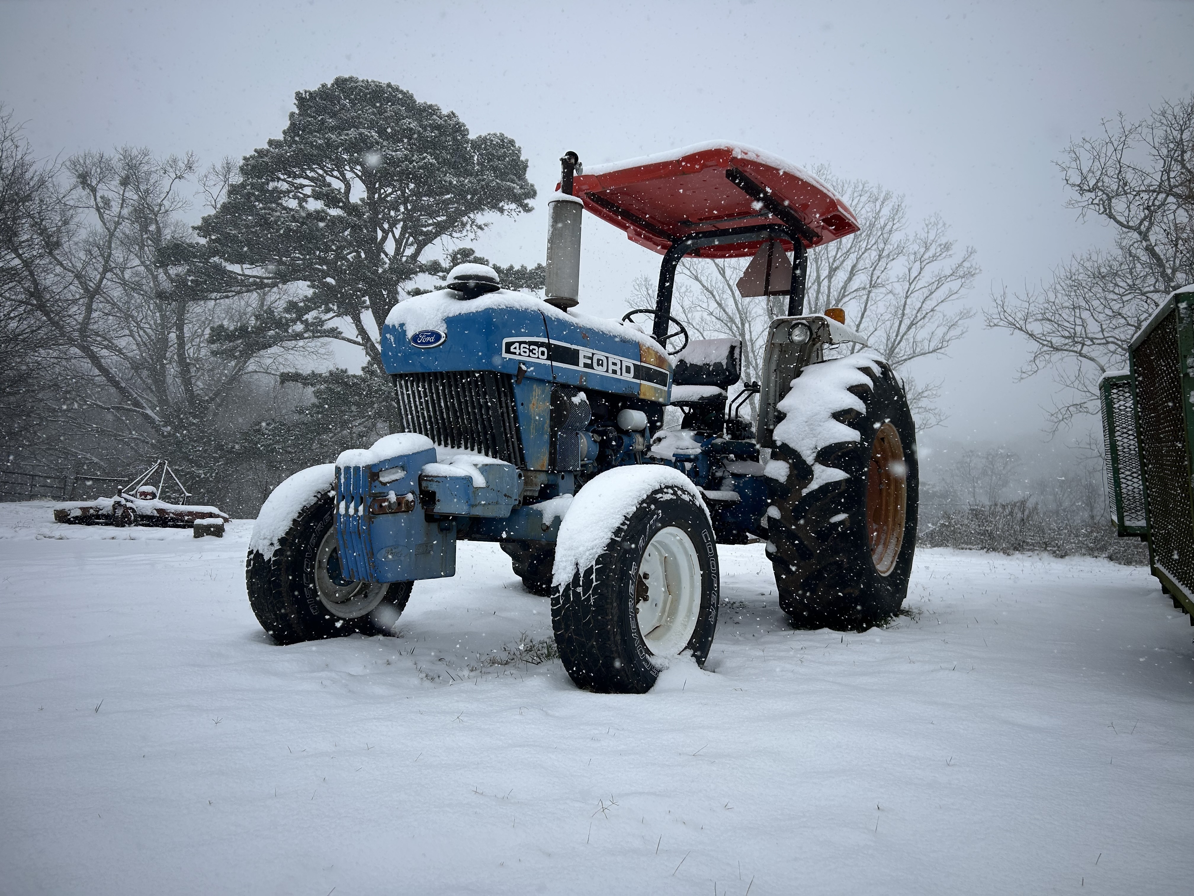 Tractor covered in snow